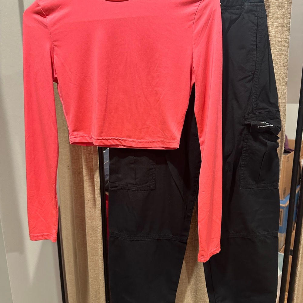Pink Long Sleeve crop Top and Black Cargo Pants.